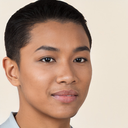 Joyful latino young-adult male with short  brown hair and brown eyes