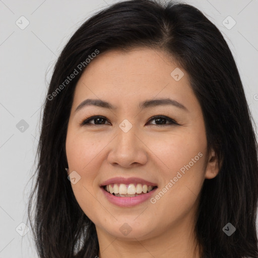 Joyful asian young-adult female with long  brown hair and brown eyes