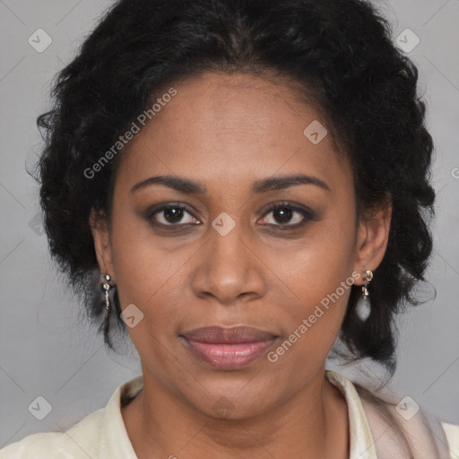 Joyful black adult female with long  brown hair and brown eyes