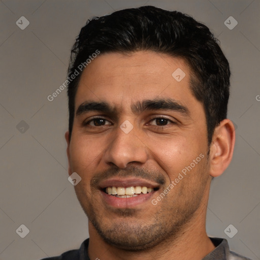 Joyful white young-adult male with short  black hair and brown eyes