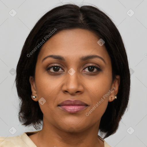 Joyful black young-adult female with medium  brown hair and brown eyes