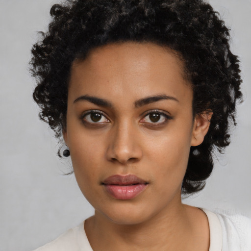 Neutral latino young-adult female with medium  black hair and brown eyes