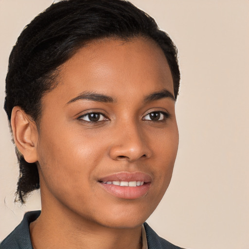 Joyful latino young-adult female with short  brown hair and brown eyes