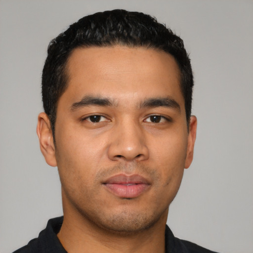 Neutral latino young-adult male with short  black hair and brown eyes