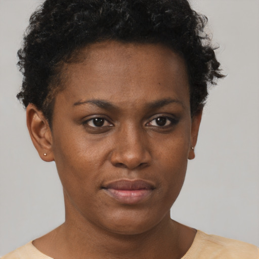 Neutral black young-adult female with short  brown hair and brown eyes