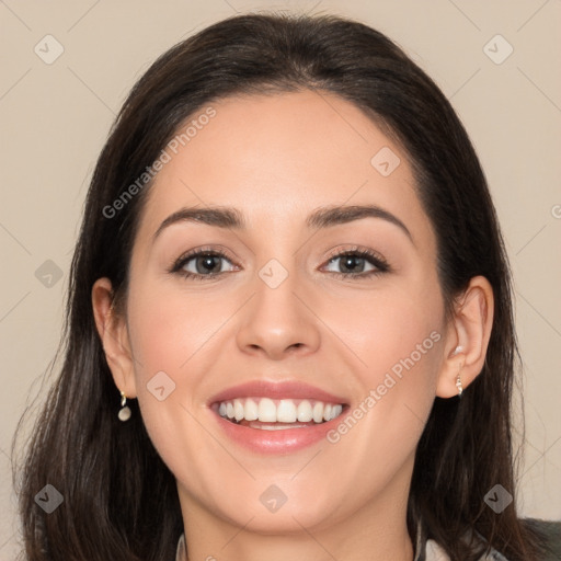 Joyful white young-adult female with long  brown hair and brown eyes