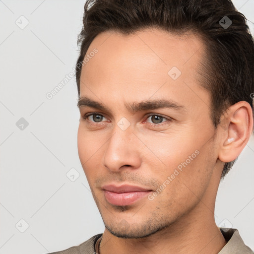 Neutral white young-adult male with short  brown hair and brown eyes