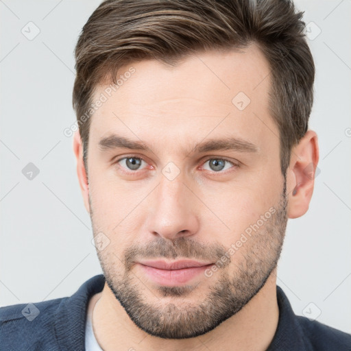 Neutral white young-adult male with short  brown hair and grey eyes