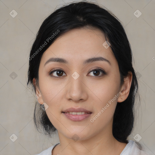 Joyful asian young-adult female with medium  black hair and brown eyes