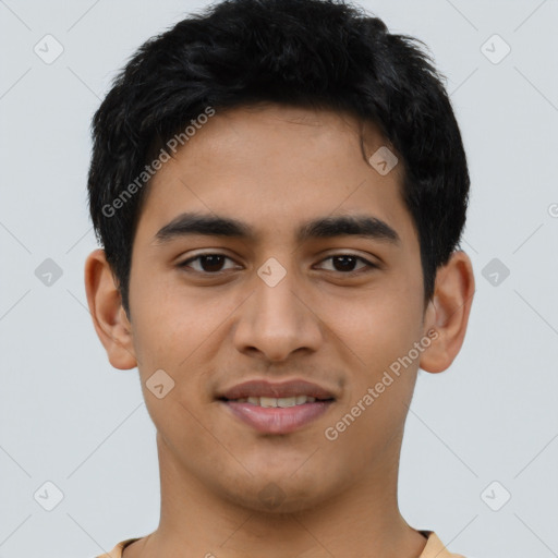 Joyful latino young-adult male with short  black hair and brown eyes