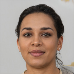 Joyful latino young-adult female with short  brown hair and brown eyes