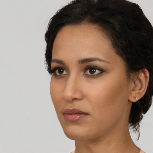 Neutral black young-adult female with short  brown hair and brown eyes