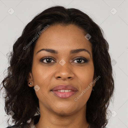 Joyful black young-adult female with long  brown hair and brown eyes