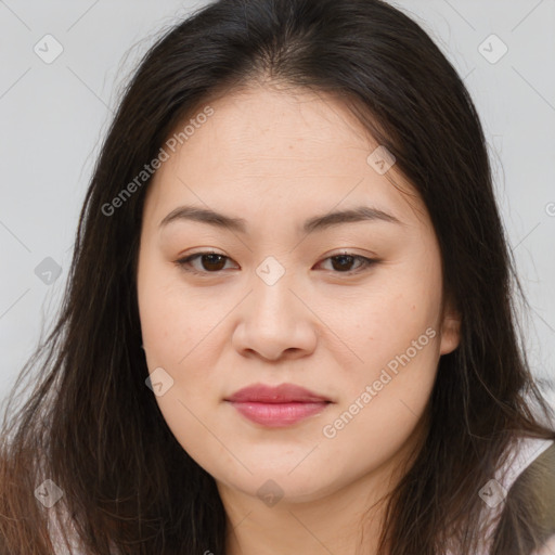 Joyful asian young-adult female with long  brown hair and brown eyes