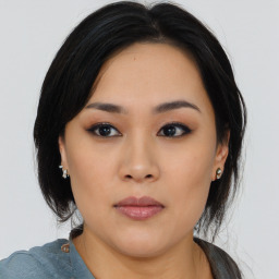 Neutral asian young-adult female with medium  black hair and brown eyes