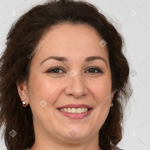 Joyful white adult female with long  brown hair and brown eyes