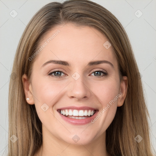 Joyful white young-adult female with long  brown hair and grey eyes