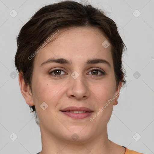 Joyful white young-adult female with short  brown hair and grey eyes