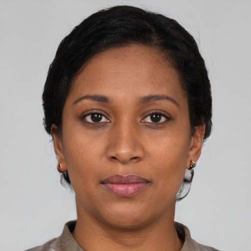Neutral latino young-adult female with short  brown hair and brown eyes