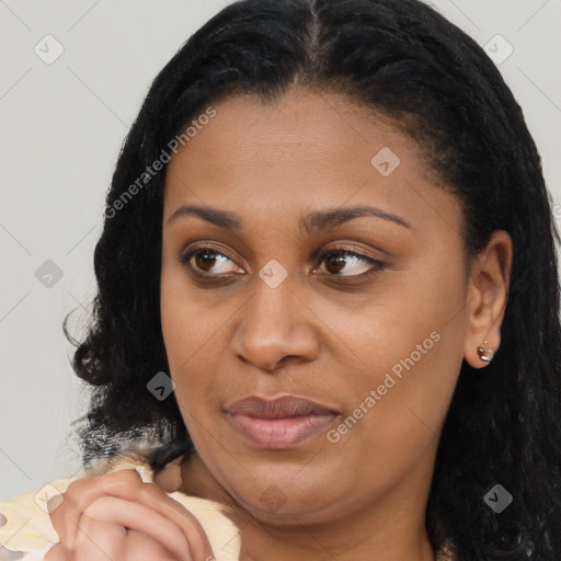 Joyful latino young-adult female with long  brown hair and brown eyes