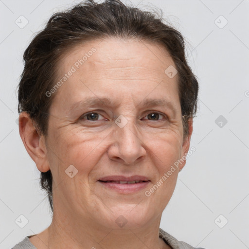 Joyful white adult female with short  brown hair and brown eyes