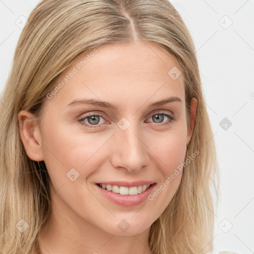 Joyful white young-adult female with long  brown hair and blue eyes