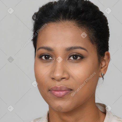 Joyful latino young-adult female with short  brown hair and brown eyes