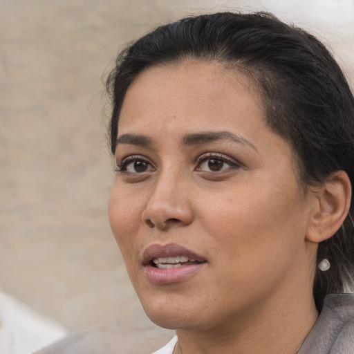 Joyful asian young-adult female with short  brown hair and brown eyes