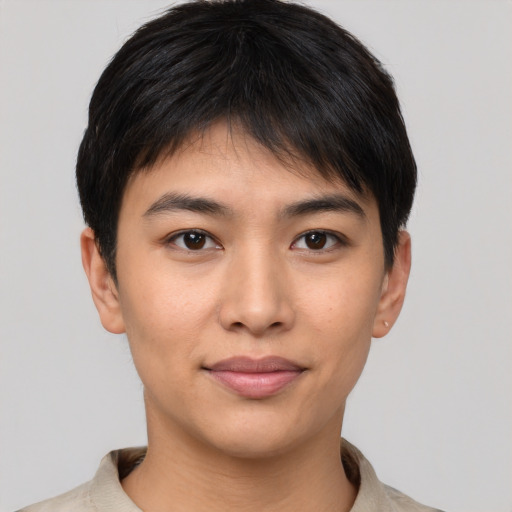 Joyful asian young-adult male with short  brown hair and brown eyes