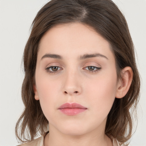 Neutral white young-adult female with medium  brown hair and brown eyes