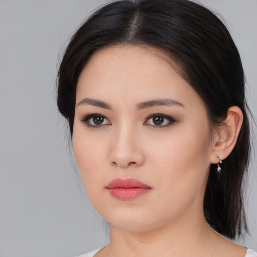 Neutral asian young-adult female with medium  black hair and brown eyes