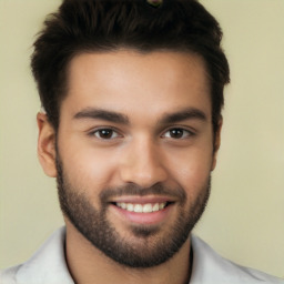 Joyful white young-adult male with short  black hair and brown eyes
