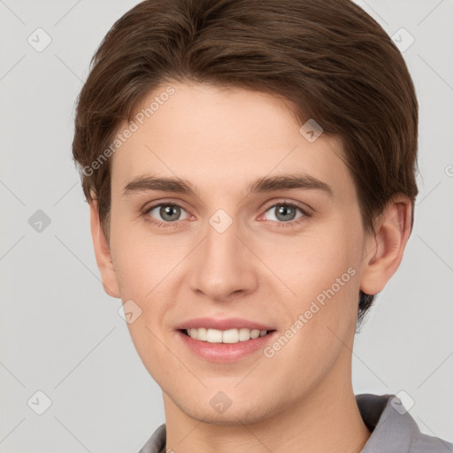 Joyful white young-adult female with short  brown hair and grey eyes