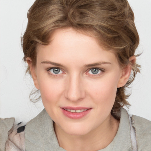 Joyful white young-adult female with medium  brown hair and blue eyes