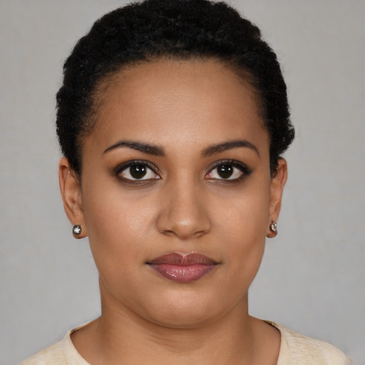 Joyful latino young-adult female with short  black hair and brown eyes