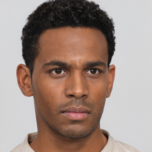 Neutral black young-adult male with short  black hair and brown eyes