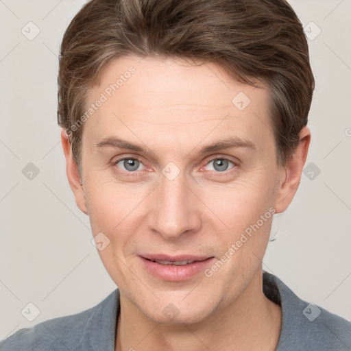 Joyful white adult male with short  brown hair and grey eyes