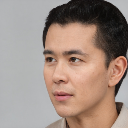 Neutral asian young-adult male with short  black hair and brown eyes