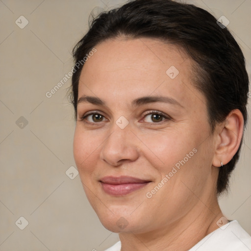 Joyful white adult female with medium  brown hair and brown eyes