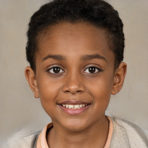 Joyful black child female with short  brown hair and brown eyes