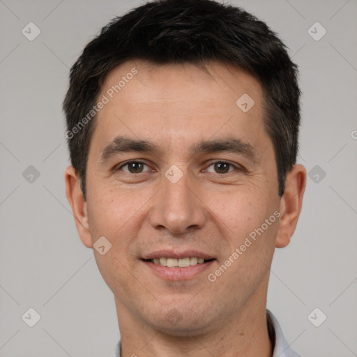 Joyful white young-adult male with short  brown hair and brown eyes