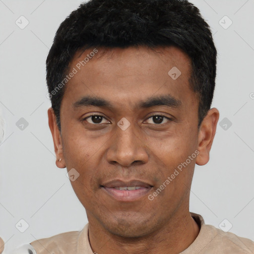 Joyful asian young-adult male with short  black hair and brown eyes
