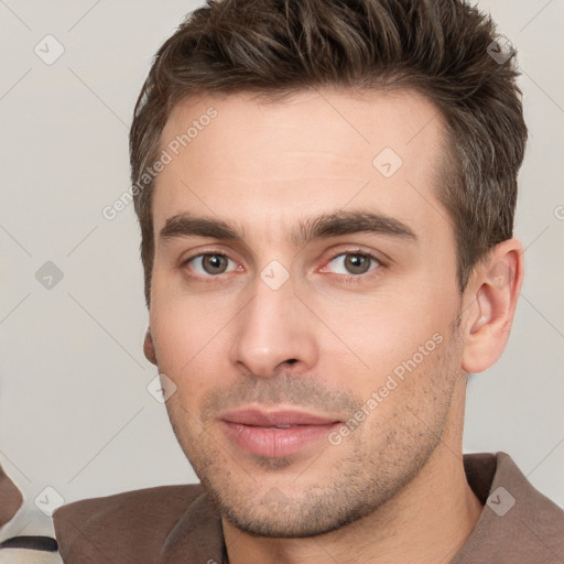 Neutral white young-adult male with short  brown hair and brown eyes