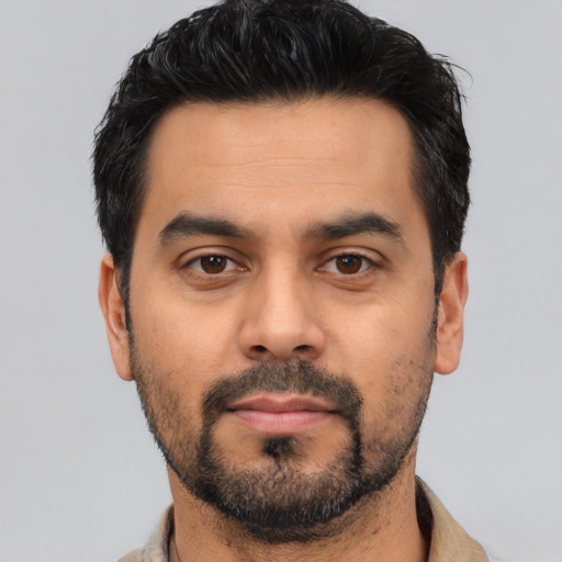 Neutral latino young-adult male with short  black hair and brown eyes