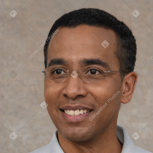 Joyful black adult male with short  black hair and brown eyes