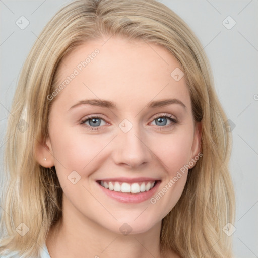 Joyful white young-adult female with long  brown hair and blue eyes