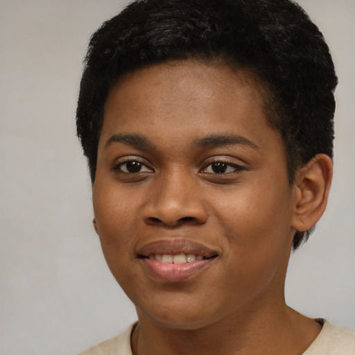 Joyful black young-adult female with short  brown hair and brown eyes