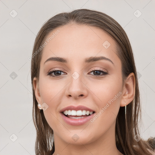 Joyful white young-adult female with long  brown hair and grey eyes