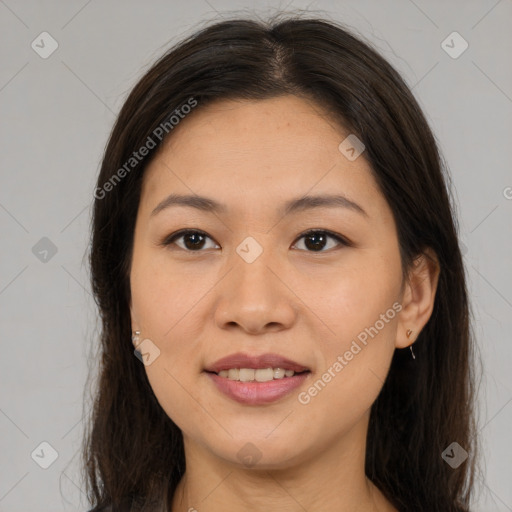 Joyful asian young-adult female with long  brown hair and brown eyes