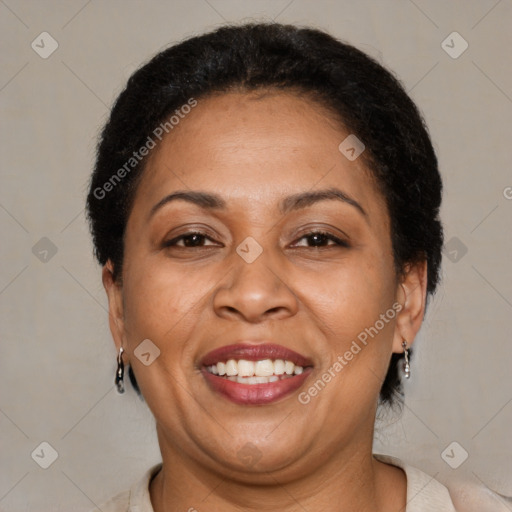 Joyful latino adult female with short  brown hair and brown eyes